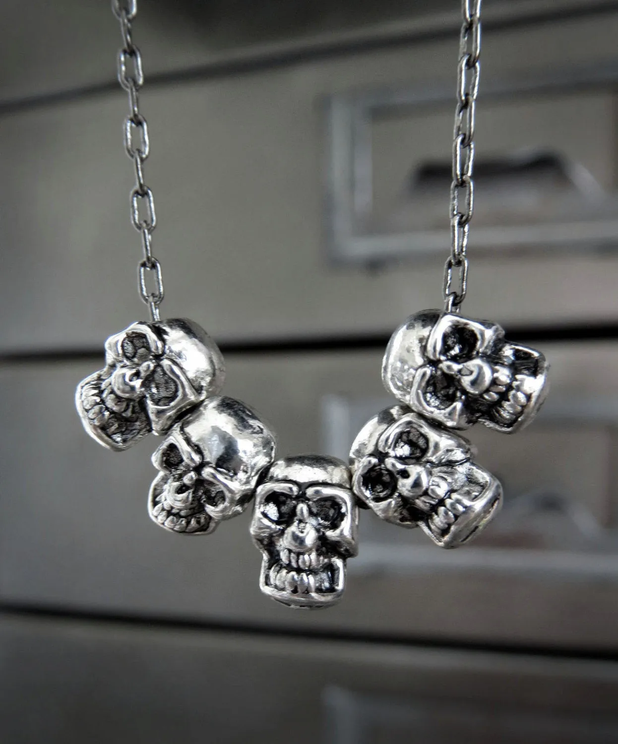Five Teeny-Tiny Silver Skulls Necklace