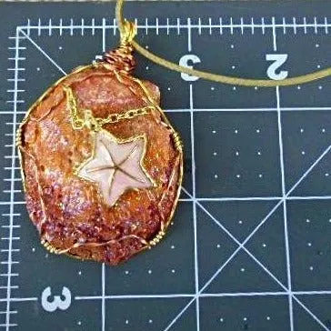 Orange Clam Shell Pendant with Pink Starfish Charm, Gold/Copper Wire Wrap, Gold Tone Rope Necklace - Handmade